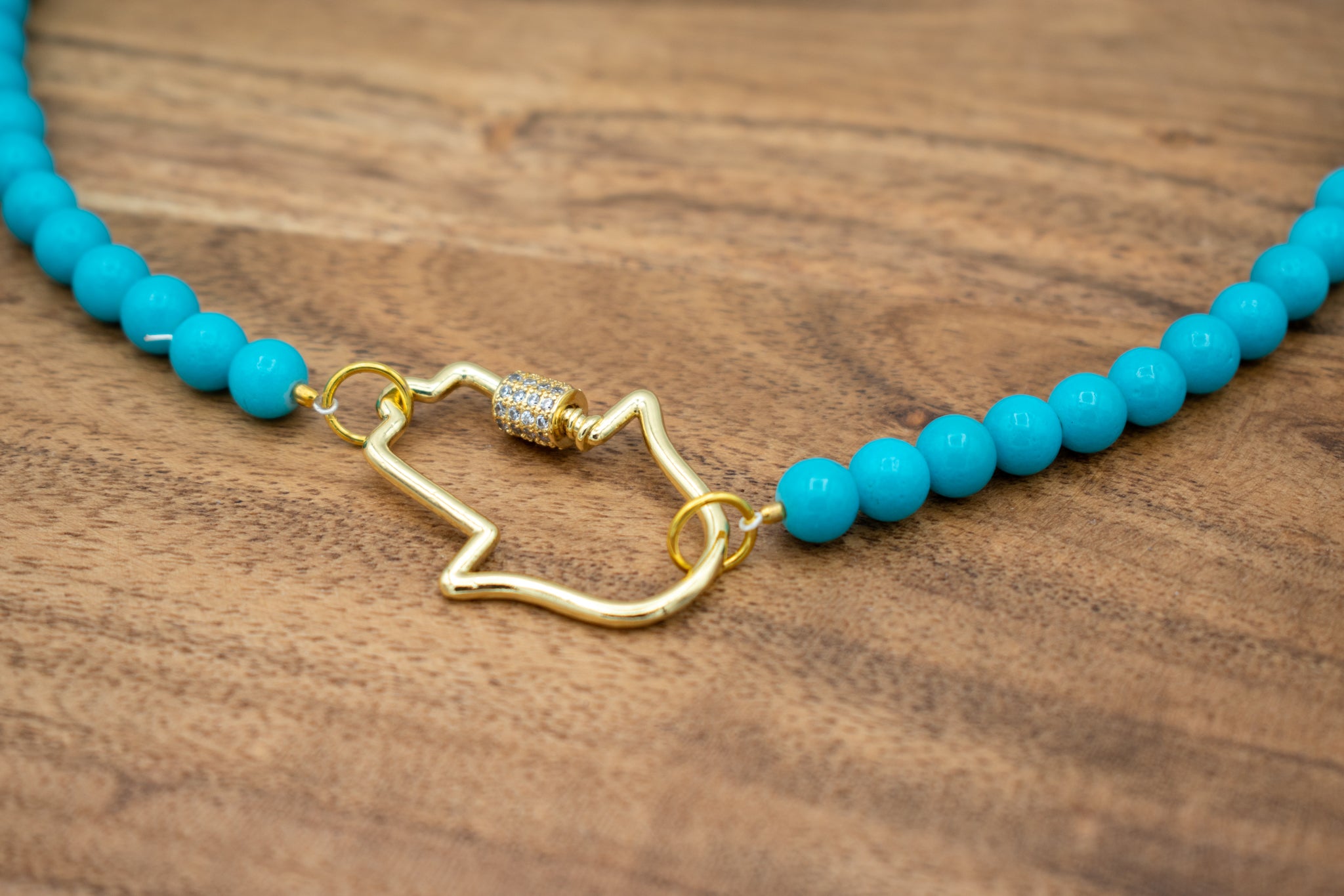 closeup of a blue necklace 