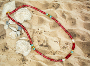 view of red bead necklace with lagoon blue, gold colored and white beads