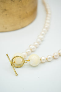 closeup of Ocean Pearl with T bar closure clasps