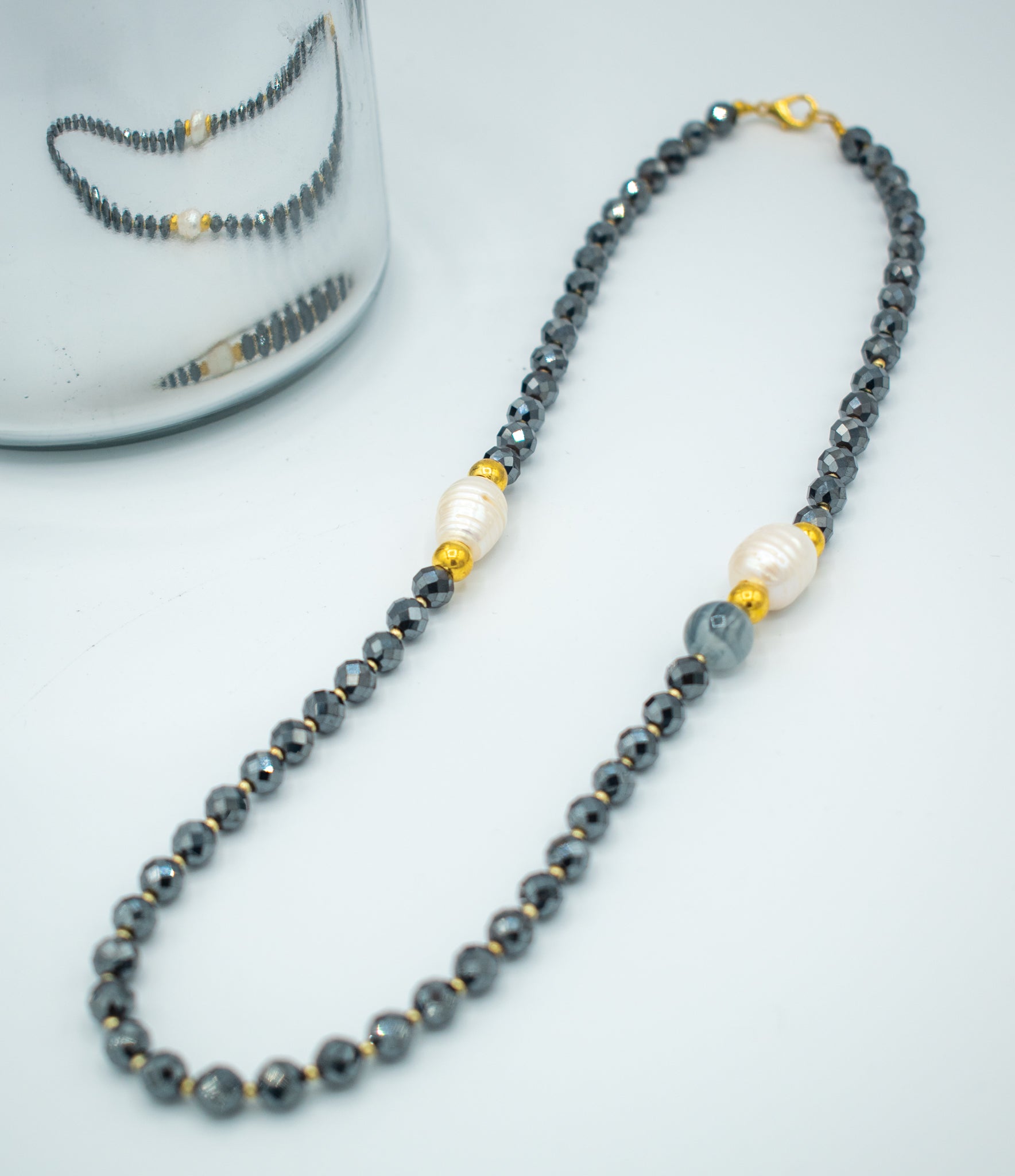 Shiny black, gold and pearls