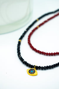 closeup of red an black 2 in 1 Evil Eye layered choker necklace