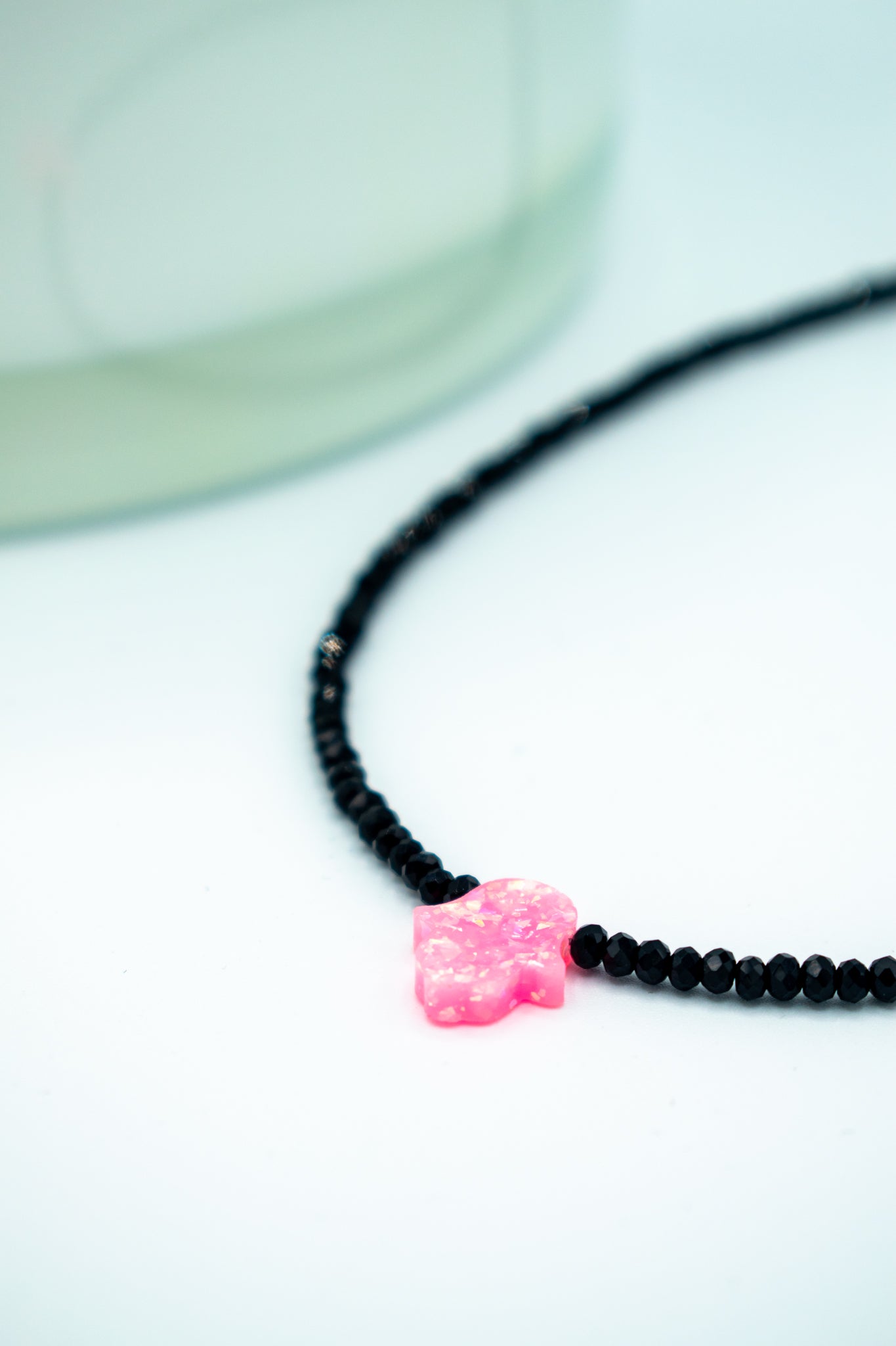 closeup of Balance Pink Luminous Hamsa Chocker