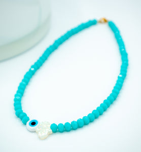 Necklace with evil eye and hamsa beads. Made with turquoise beads