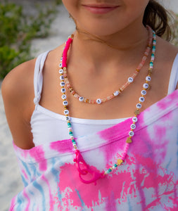 kids wearing a words necklace 