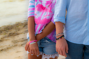 man and woman wearing bracelets