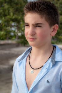 boy wearing Star of David necklace