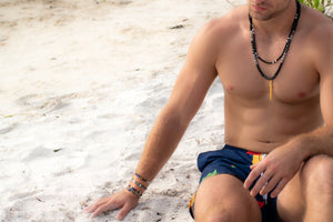 man wearing a beaded necklace