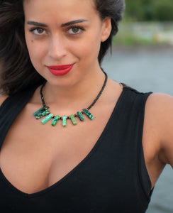 woman wearing Green crown healing necklace