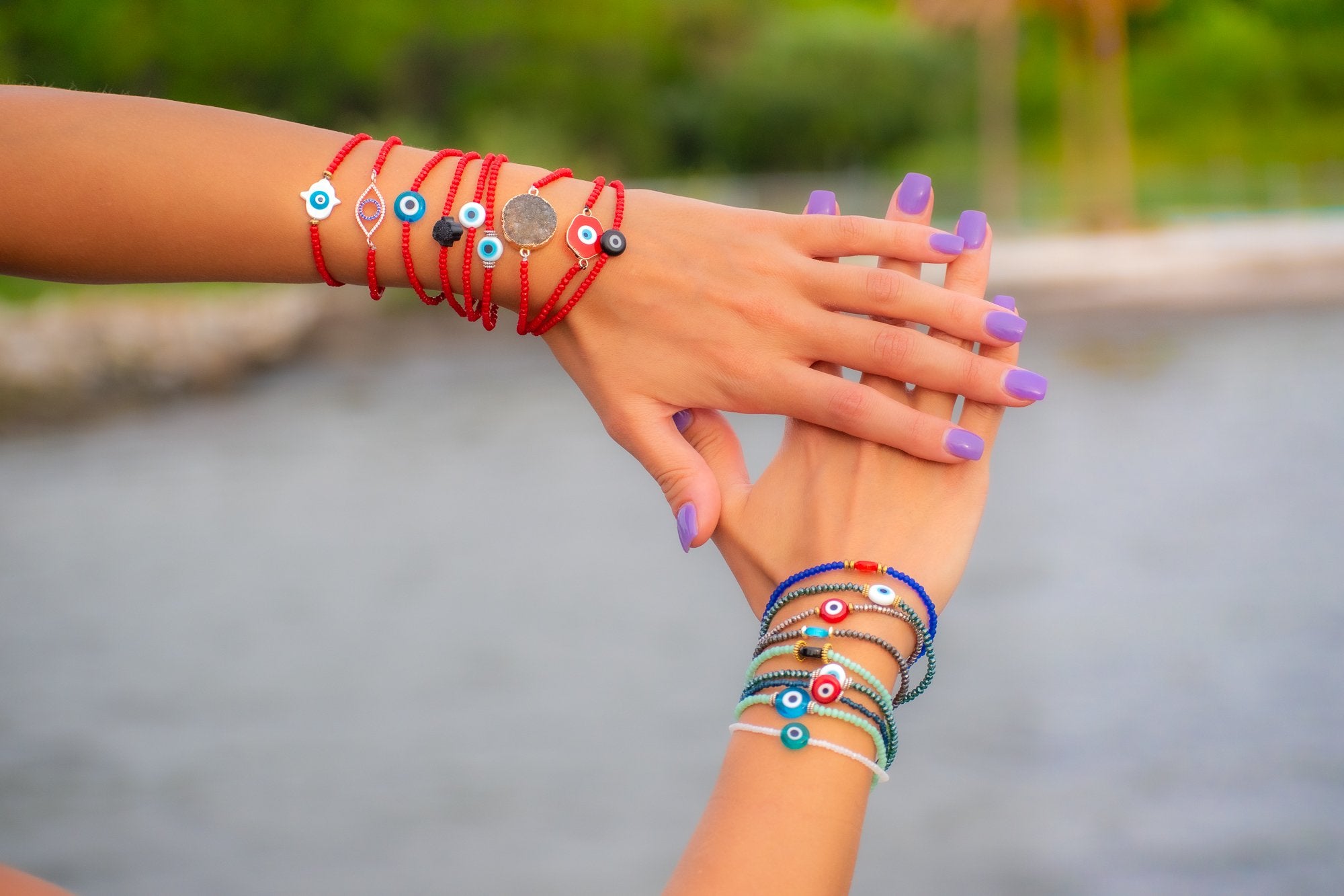 woman showing various bracelets