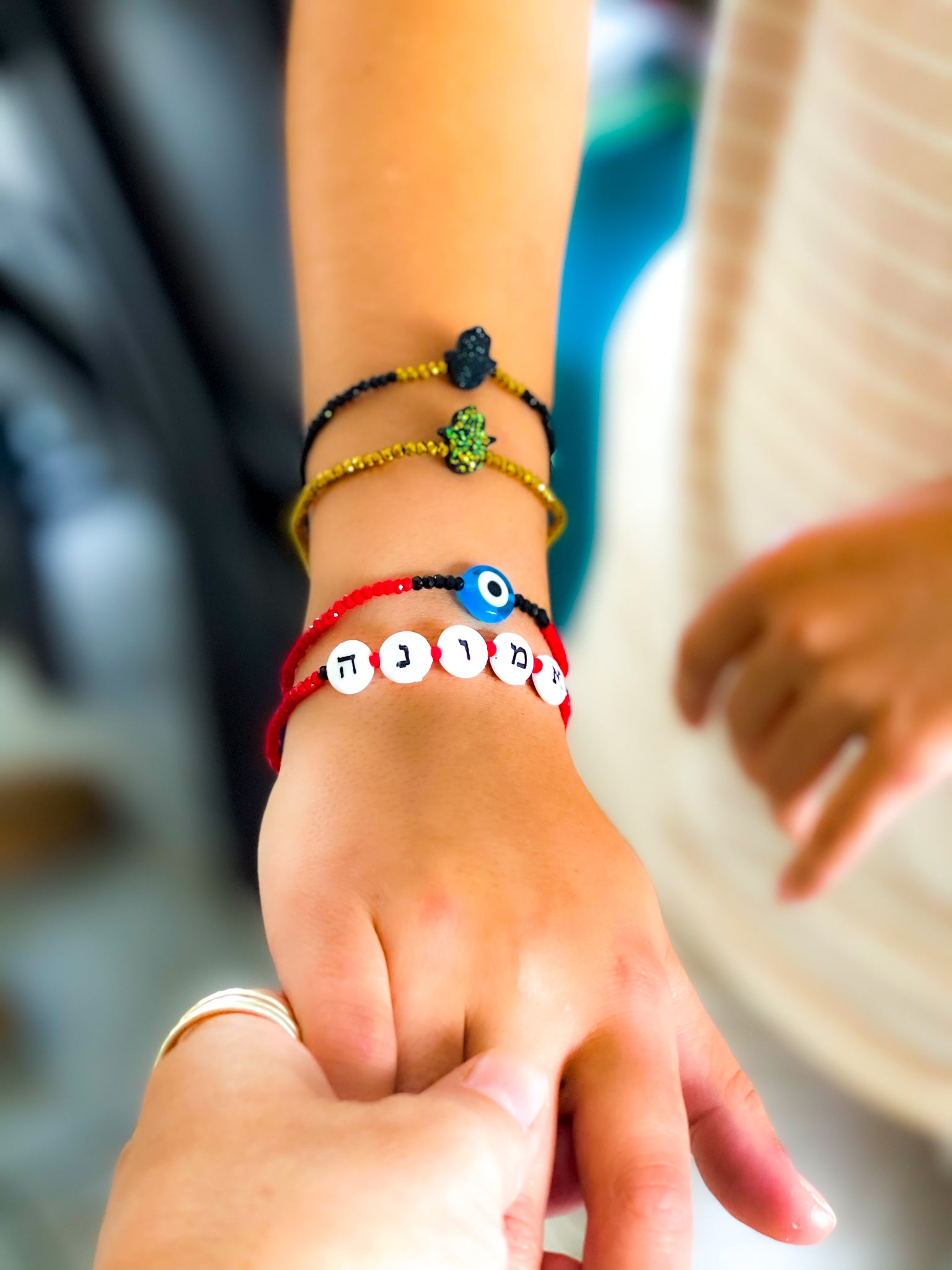 woman wearing a words bracelet